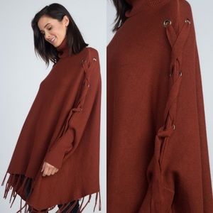 Fashionomics Sweaters - Turtleneck Fringe Poncho with tied sleeves Fashionomics Sweaters - Turtleneck Fringe Poncho with tied sleeves